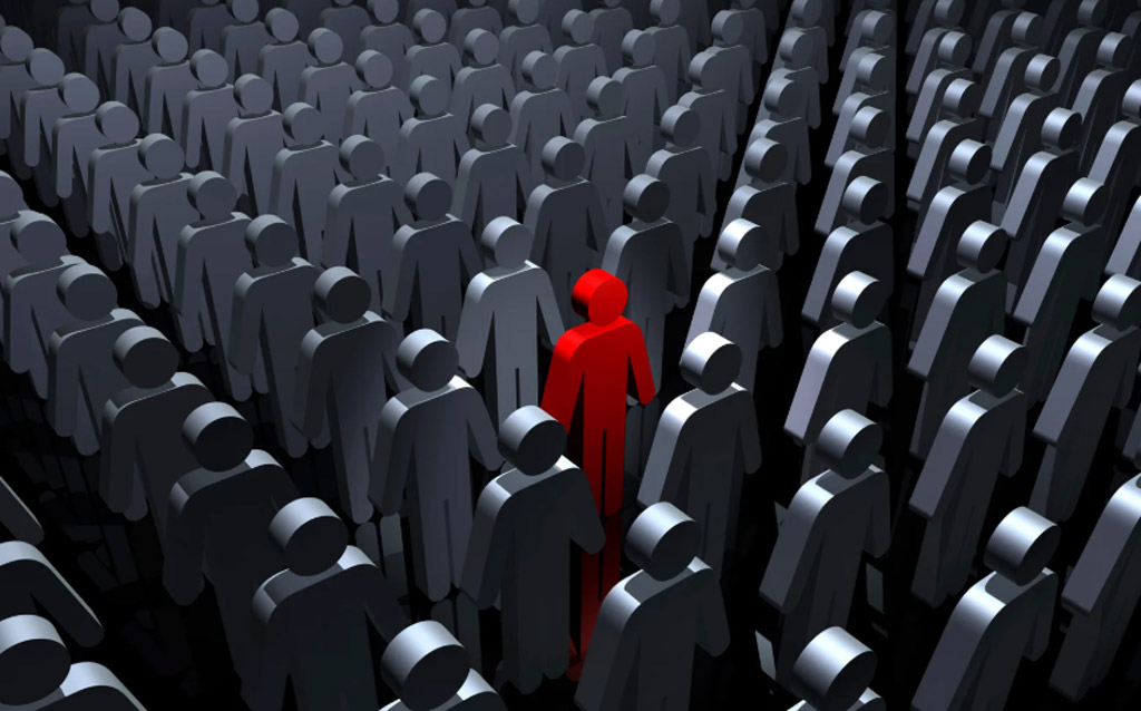 illustration of grey, abstract human beings standing in rows with one red figure in the middle
