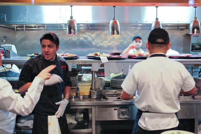 restaurant kitchen with chefs at work